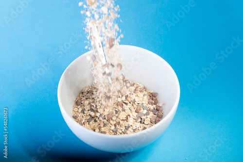Breakfast bowl is filled with fresh muesli with fuzziness