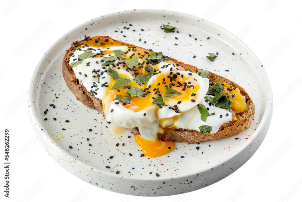 Avocado toast with poached egg on a wooden board. Breakfast concept. 45 view Avocado toast with poached egg on a wooden board. Breakfast concept. 45 view