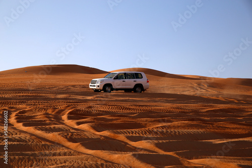 Off road vehicle on sand dunes, Oman