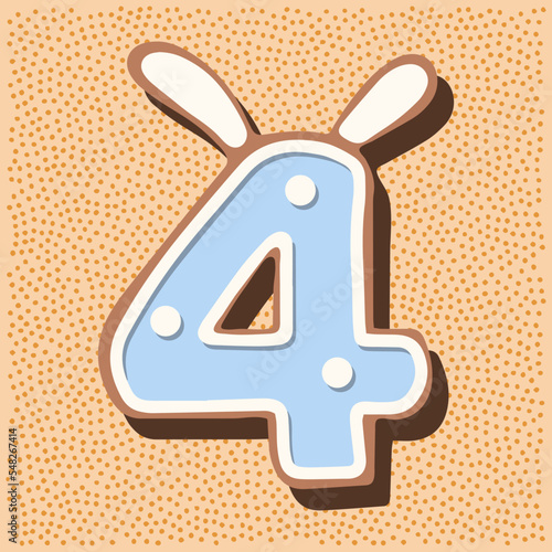 Christmas gingerbread in the shape of the namber with rabbit ears, white blue glaze, polka dots photo