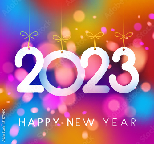 Hanging 2023 sign on colorful background.