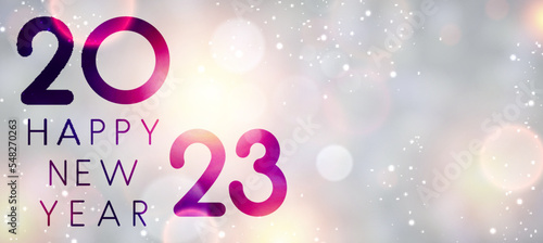 Banner with 2023 happy new year sign on sweaty grass.