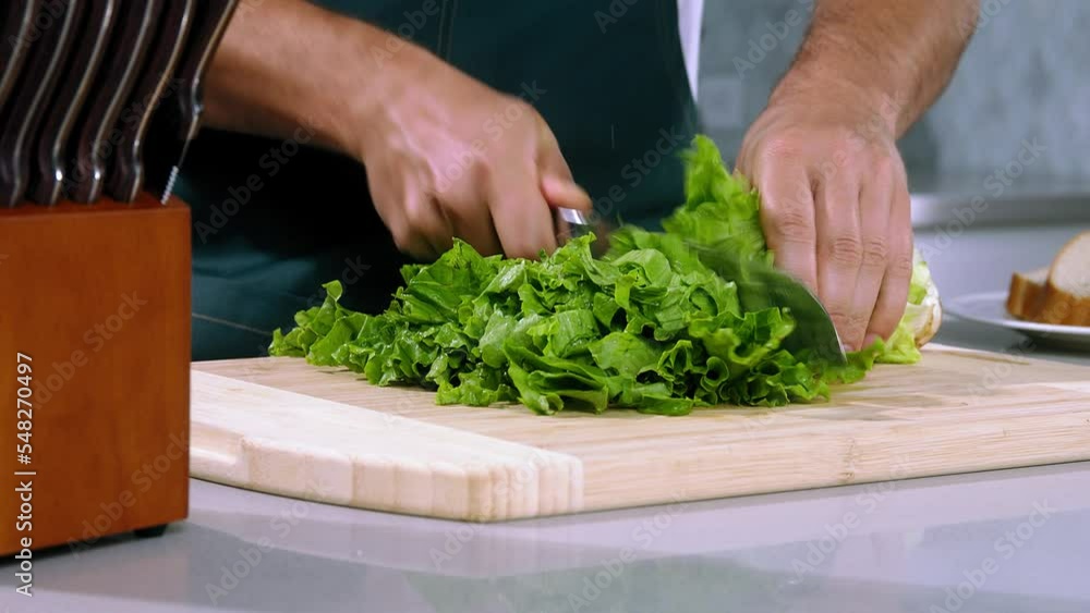 chef cuts the salad slow motion, chief make salad, slice the salad close-up chef cuts the salad slow motion, chief make salad, slice the salad close-up