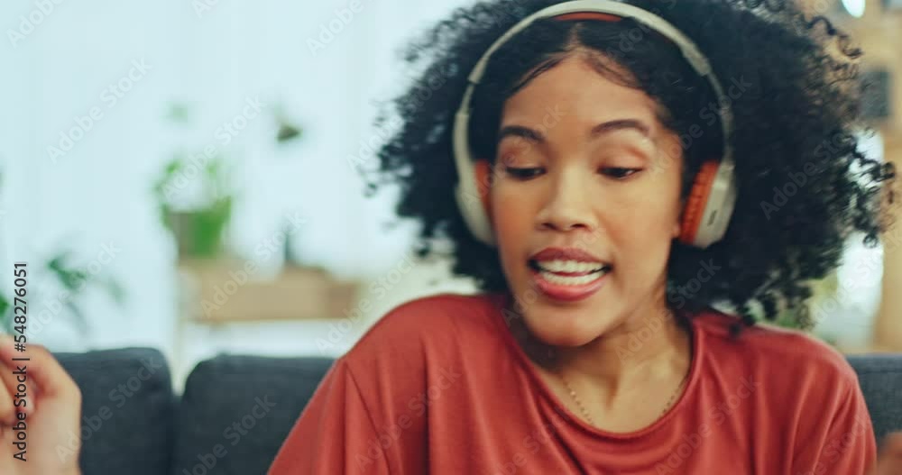 Black woman, dancing and headphones on sofa, silly and singing words in living room. Young girl, headset and student carefree for contemporary dancer, moving with rhythm, confident and relax on break Black woman, dancing and headphones on sofa, silly and singing words in living room. Young girl, headset and student carefree for contemporary dancer, moving with rhythm, confident and relax on break