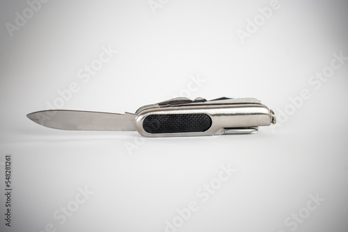 Pocket knife swiss knife close up white background 