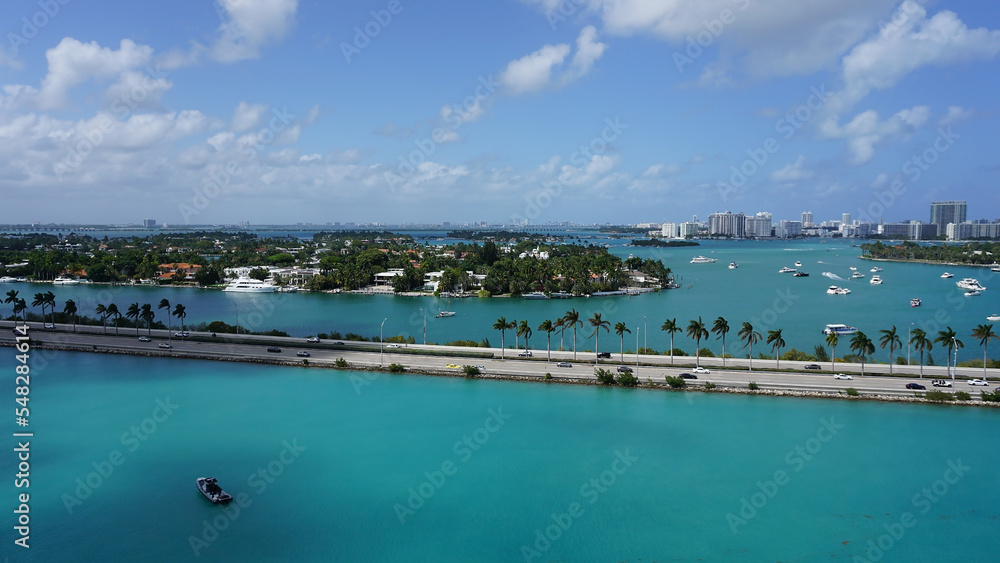 Aerial view of waterfront residential and office buildings Biscayne Bay on sunny cloudless morning in Miami, Florida.