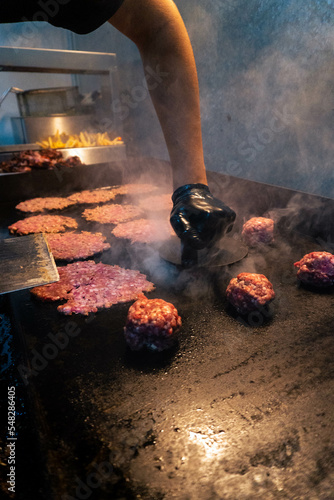 man smashing burger