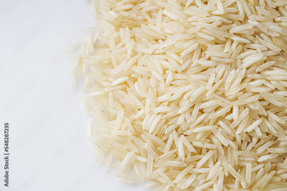 Fototapeta premium raw basmati rice on a white acrylic background