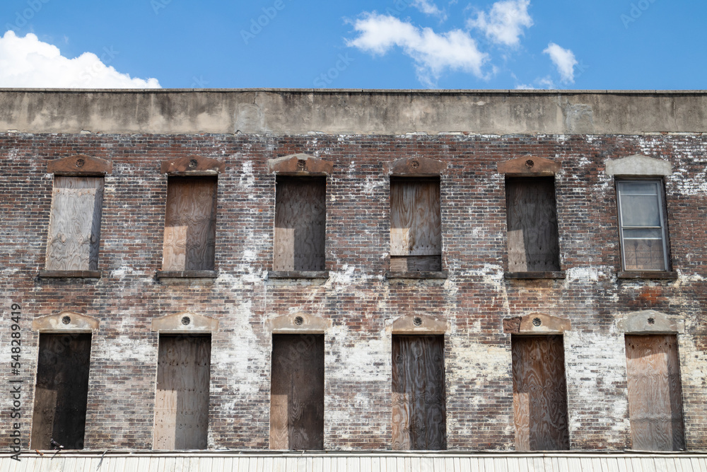 Old Brick Building with Boarded Up Windows in Brooklyn of New York City Old Brick Building with Boarded Up Windows in Brooklyn of New York City
