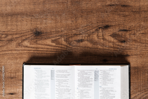 An open Bible on a wooden table, copyspace, flat lay bible