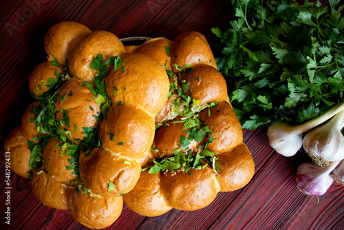 Traditional Ukrainian pastry with garlic and herbs. Ukrainian pampushka addition to borscht photo