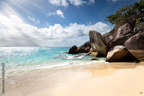 Beautiful paradise beach with white sand, rocks an turquoise water on a tropical island, Fitzroy Island, Far North Queensland, Australia