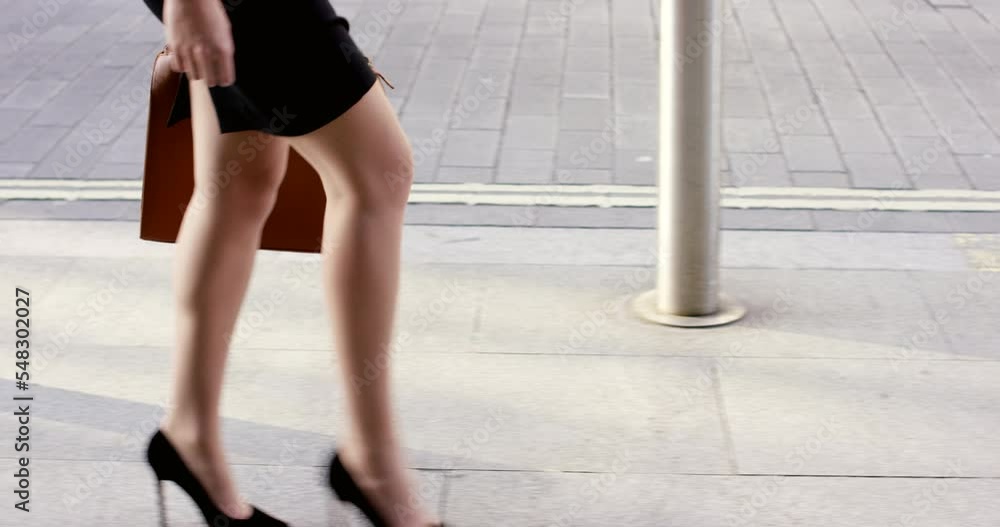 Legs, business woman and walking to work in city, street or urban road outdoors. Profile, travel and professional female lawyer in heels traveling or commute on asphalt or concrete sidewalk in town. Legs, business woman and walking to work in city, street or urban road outdoors. Profile, travel and professional female lawyer in heels traveling or commute on asphalt or concrete sidewalk in town.