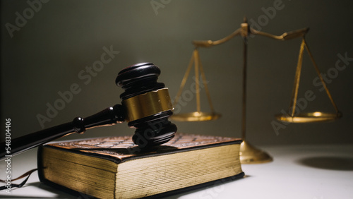 Business and lawyers discussing contract papers with brass scale on desk in office. Law, legal services, advice, justice and law concept