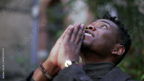 Fotografie, Tablou Religious young black man praying to God