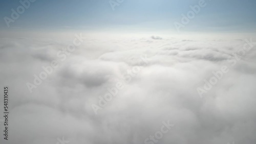 Wallpaper Mural Aerial shot of flying over a layer of soft clouds at dawn Torontodigital.ca
