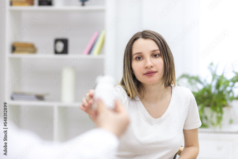 Photo of pregnant woman reaching out to doctor. Photo of pregnant woman reaching out to doctor.