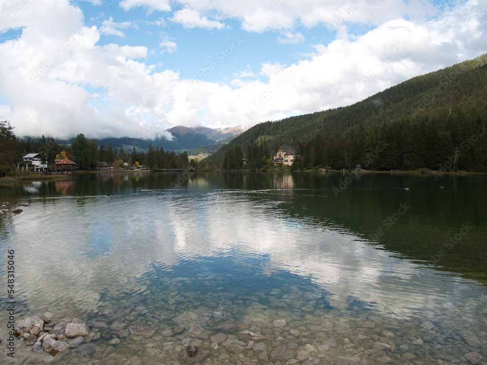 Fototapeta premium Autumn morning after the rain by the lake of Dobbiaco(Toblacher See). South Tyrol, province of Bolzano. Dolomites, Italy.