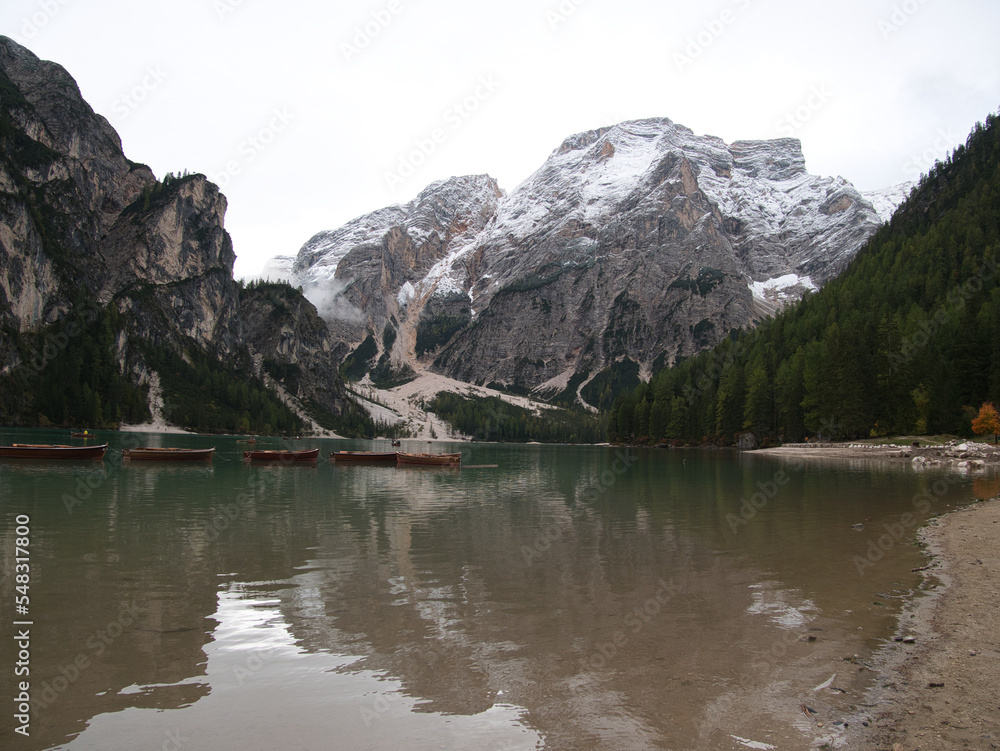 Fototapeta premium A gloomy autumn morning on the shores of Lake Braies. Dolomites, Italy.