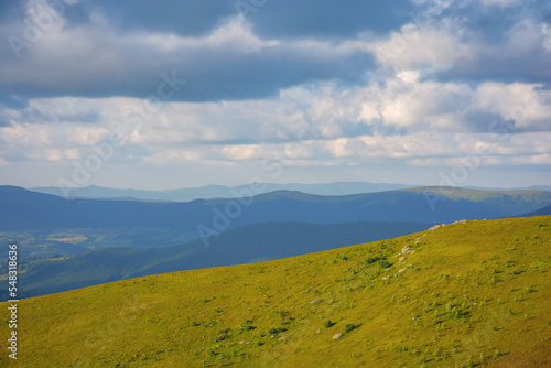 wonderful nature background in mountains. green landscape in evening light. view in to the distant valley