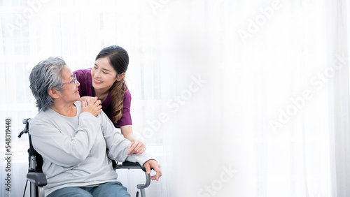 Medical staff taking and caregiver senior woman in Home. Home care concept. © NewSaetiew