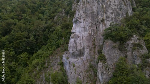 Aerial video of the statue of Decebal, located on the gorges of Danube river in Romania. Video was shoot from a drone with camera lowered with the statue in the view.