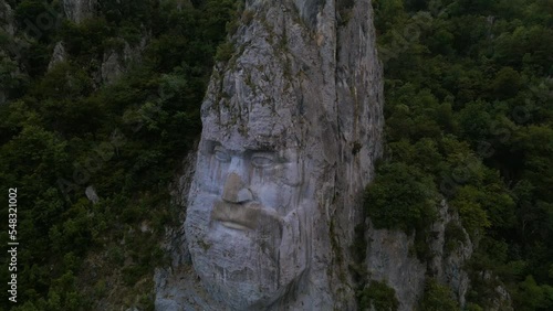 Aerial video of the statue of Decebal, located on the gorges of Danube river in Romania. Video was shoot from a drone with camera lowered with the statue in the view.