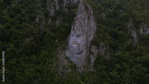 Aerial video of the statue of Decebal, located on the gorges of Danube river in Romania. Video was shoot from a drone with camera lowered with the statue in the view.