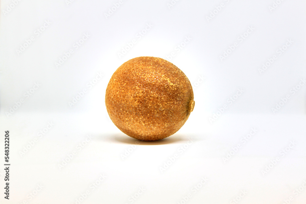 Single dry lemon on white background. Selective focus Single dry lemon on white background. Selective focus
