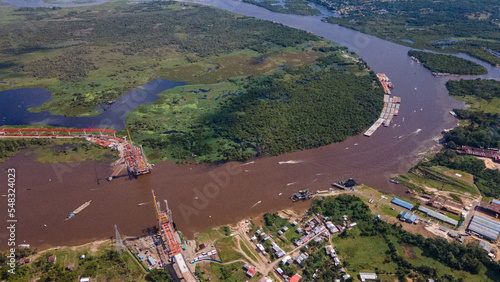 Drone aerial image of the Nanay River, where a bridge is being build at Amazon, Iquitos, Loreto, Peru, South America photo