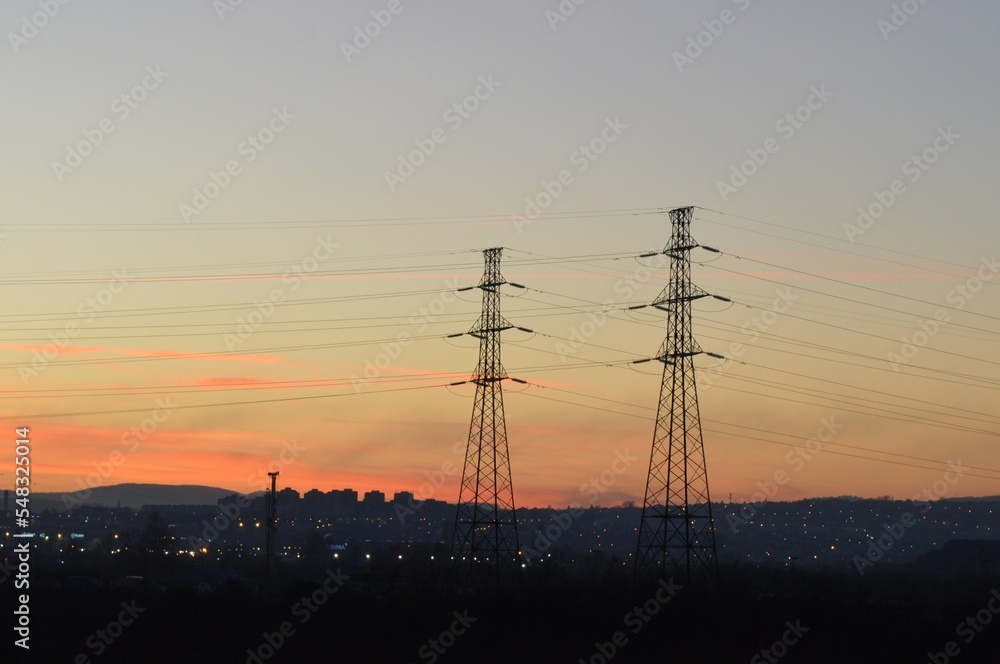 Silhouette of an electric tower for the transmission of high voltage electricity