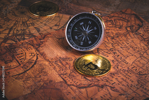 Compass and bitcoin. Travel and cryptocurrencies. Buying tickets with bitcoins.