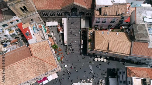 Aerial view of Amalfi Coast, Italy. Drone view of Cathedral of Saint Andrew, embankment, red roofs of buildings in old town, historical and tourist places, and cruise ship