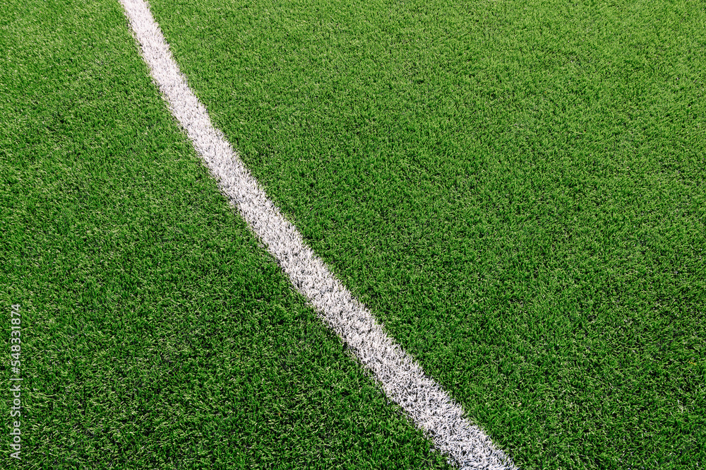 Texture of Perfect green lawn on the football field