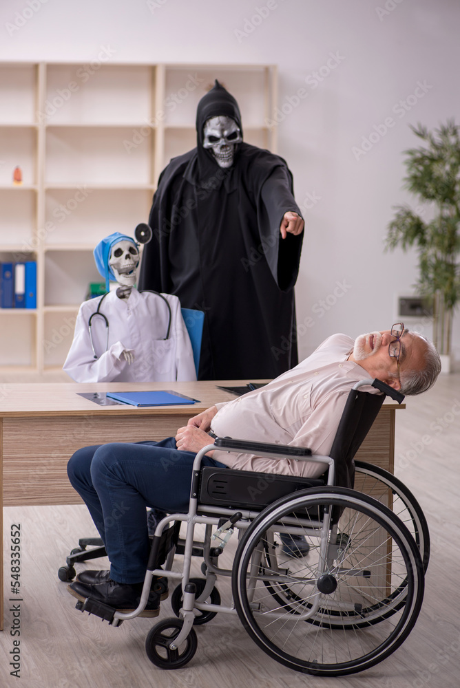 Old patient in wheel-chair visiting two devil doctors