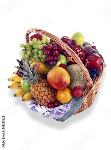 basket with various fruits seen from above on white background