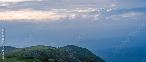 Aerial panoramic view of beautiful cloudscape over Matagalls peak of the Montseny Massif, Catalonia photo