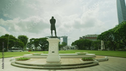 Stamford Raffles statue overlooking Marina Bay Sands, Singapore photo