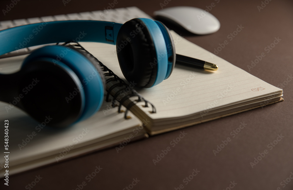 Headphones and notepad Headphones and notepad
