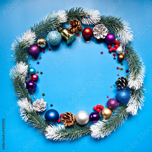 Christmas composition. Wreath made of christmas tree branches and pine cones . Flat lay, top view, copy space.