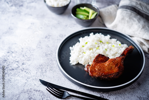 Peking duck with rice on a plate