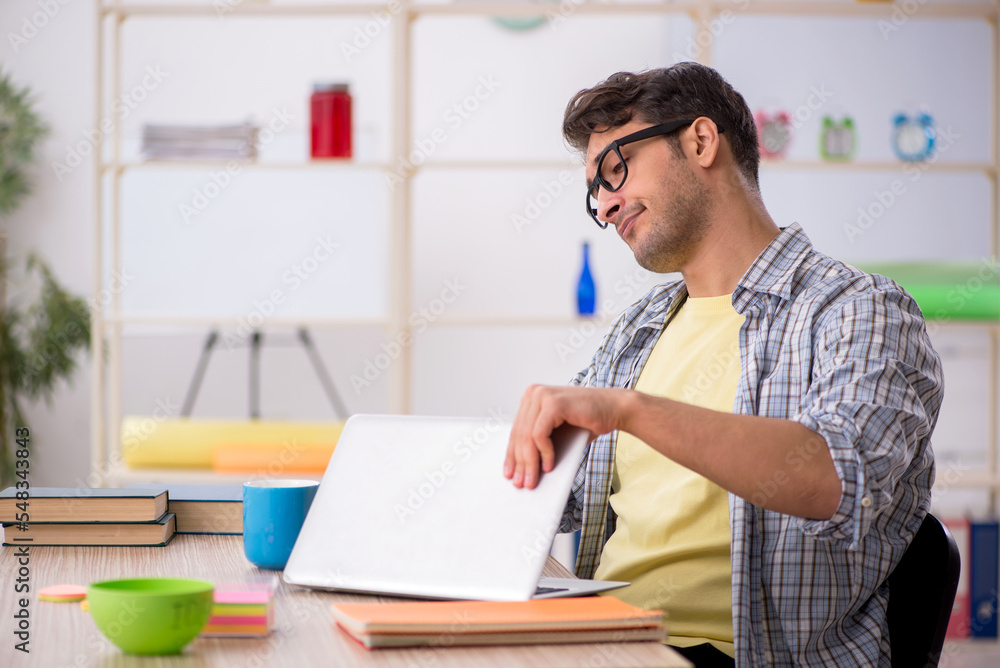 Young male freelancer working from home