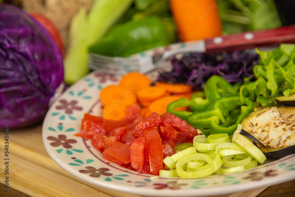 Porcelain plate with sliced vegetables. Porcelain plate with sliced vegetables.