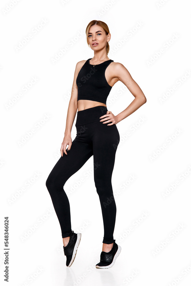 woman in sportswear training . slim girl in black sport leggings woman in sportswear training . slim girl in black sport leggings