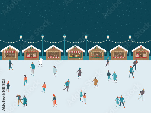 People skating at Christmas market ice rink.