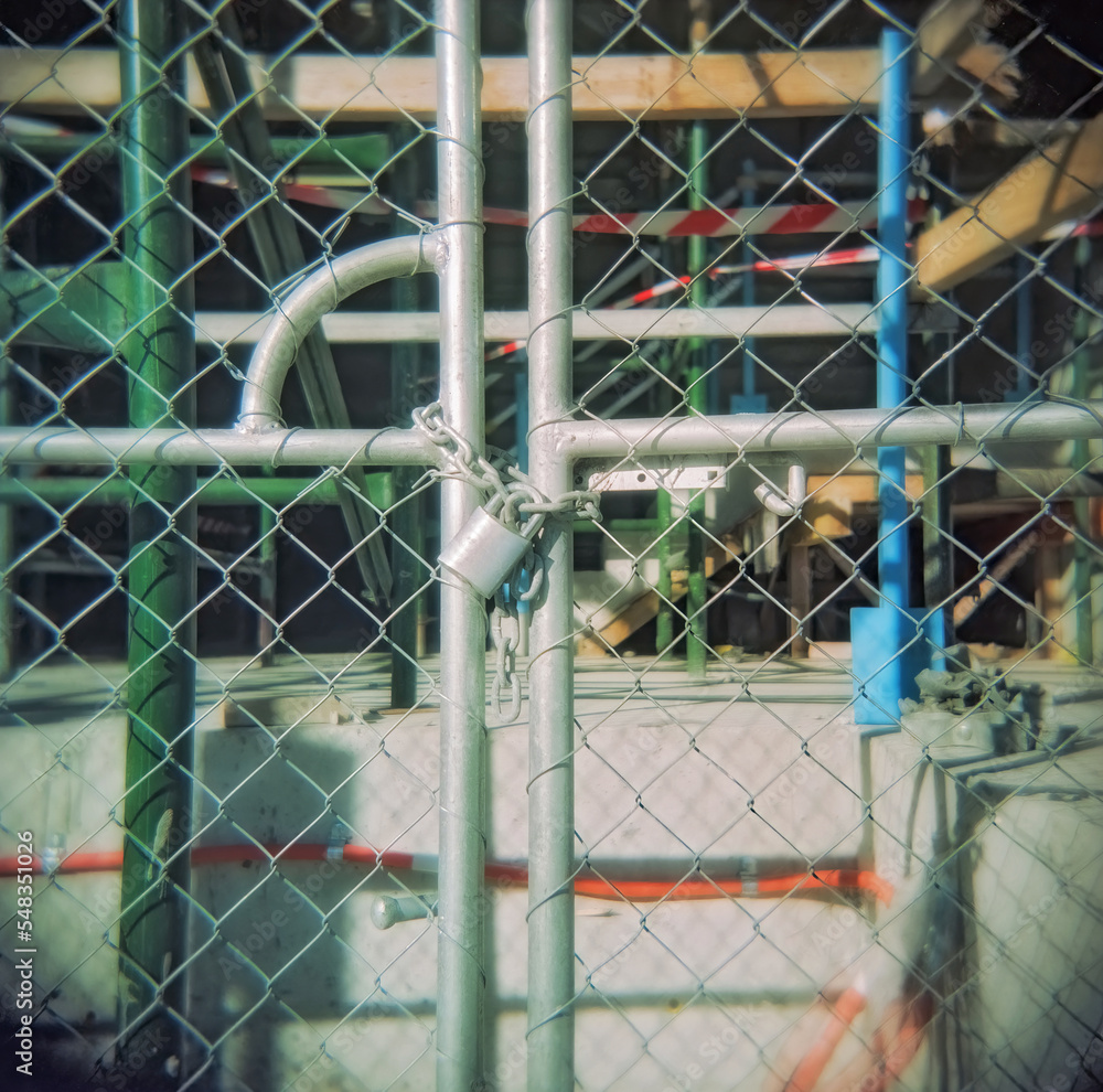 Padlocked gate of a building site