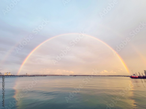 Fototapeta Naklejka Na Ścianę i Meble -  Rainbow over the sea. Beautiful seascape after rain with rainbow