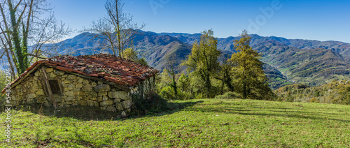 Landscape with stone cabin in meadow of the council of Teverga, Teberga , in Asturias.