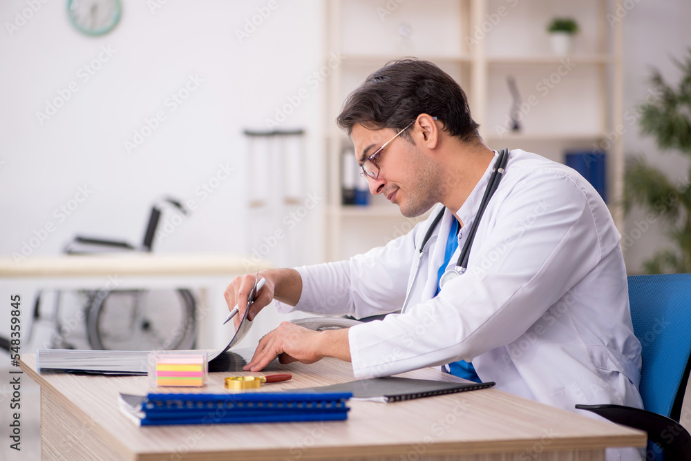 Young male doctor radiologist working in the clinic Young male doctor radiologist working in the clinic