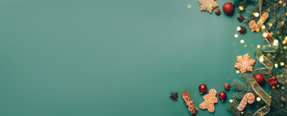 Christmas flat lay, festive background, gingerbread, New Year's toys, fir branches, green background